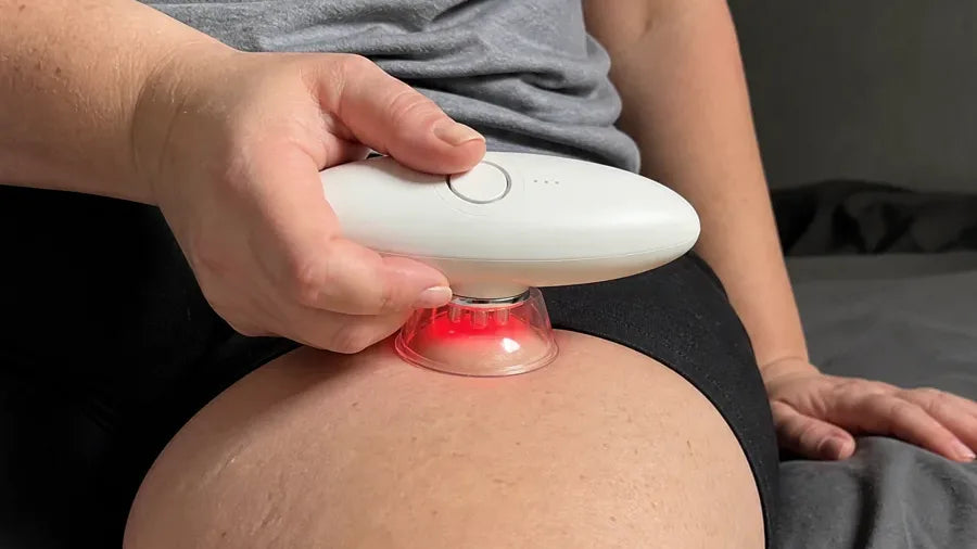 CONTURA on the thigh with the red light on